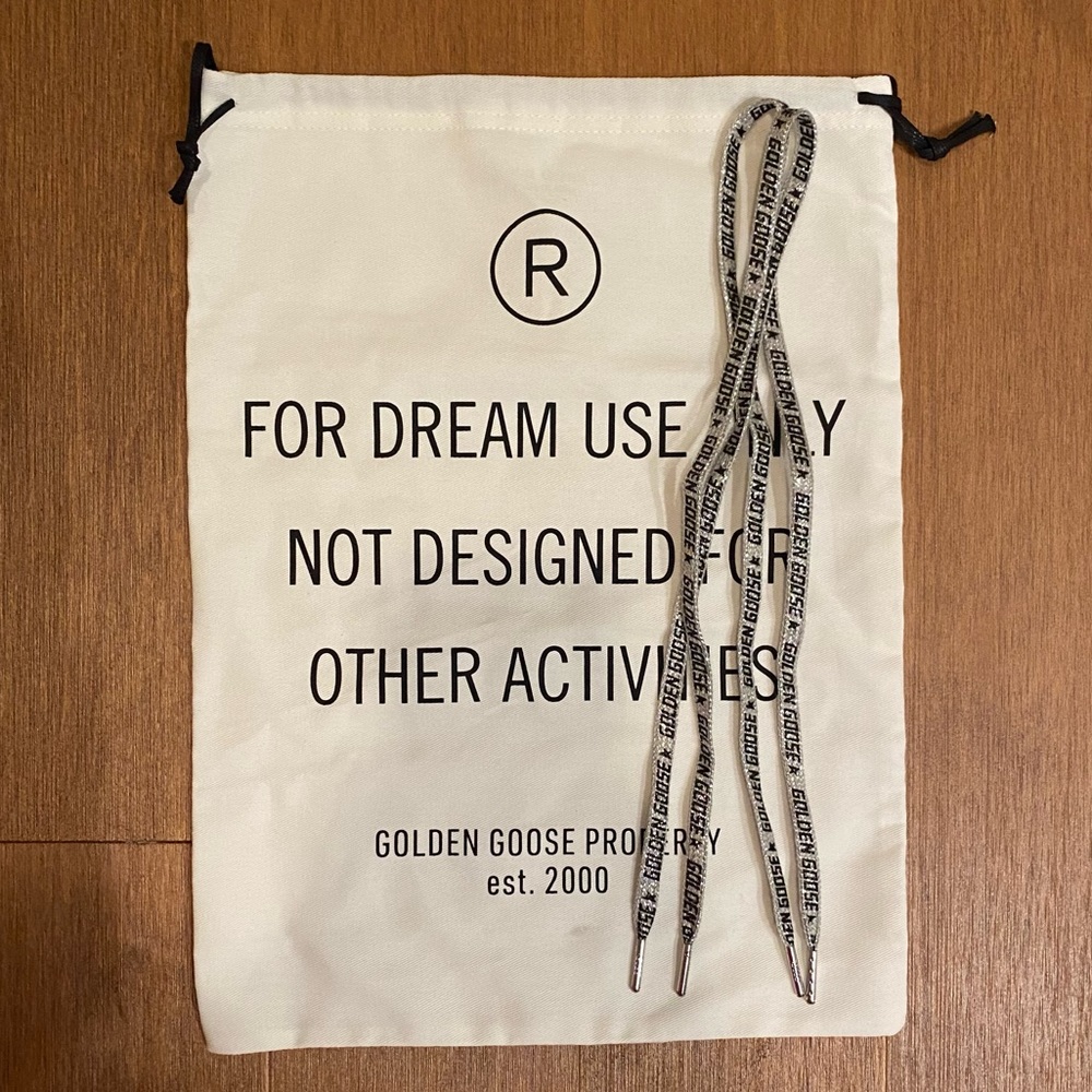 Golden Goose dust bag and authentic glitter logo laces. Never used. Brand new.